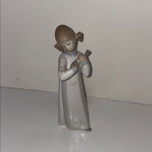 Lladro Girl Figurine Playing Guitar. 8 inches tall.
